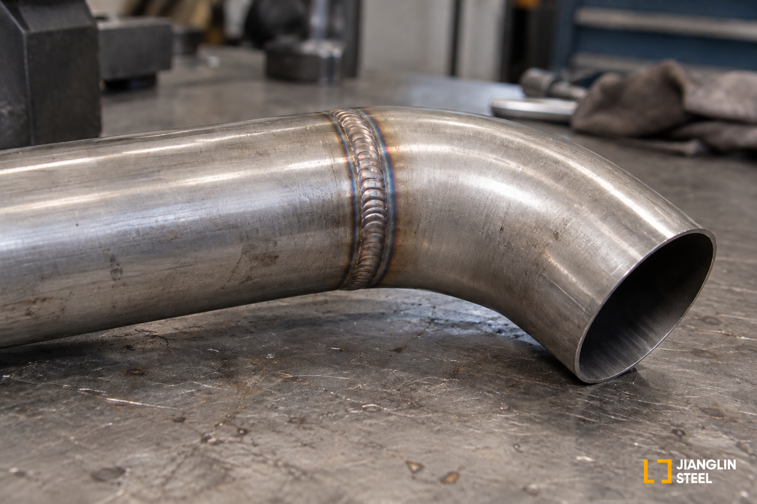 Weld heat tint around a stainless steel pipe elbow joint